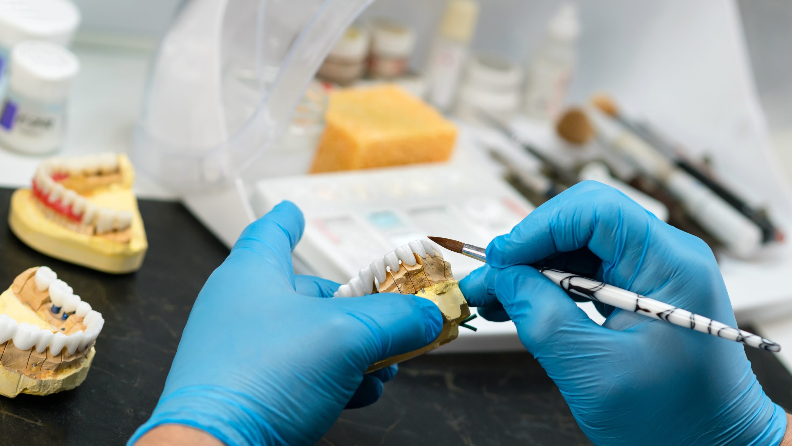 Dental,Prosthesis,Work.,Denture,Work.,Teeth,Painting.,Dental,Technician,Working